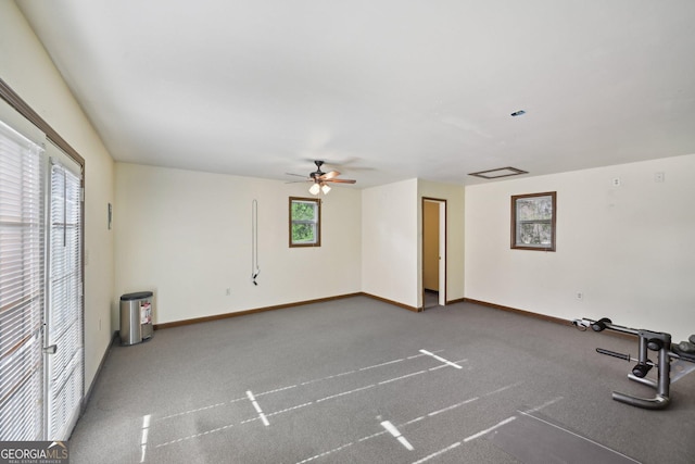 2768 Southpark Blvd SW, Conyers, GA 30094 - spare room featuring a ceiling fan, baseboards, and carpet flooring
