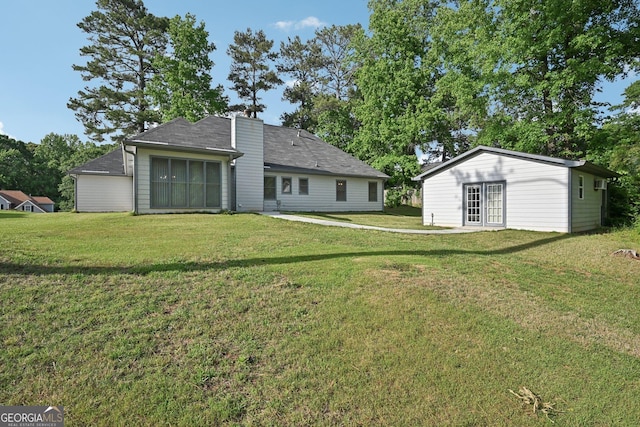 2768 Southpark Blvd SW, Conyers, GA 30094 - rear view of house featuring a yard and roof with shingles