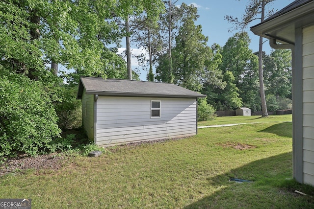 2768 Southpark Blvd SW, Conyers, GA 30094 - view of grassy yard featuring a storage unit and an outbuilding