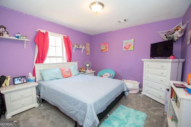 carpeted bedroom with visible vents