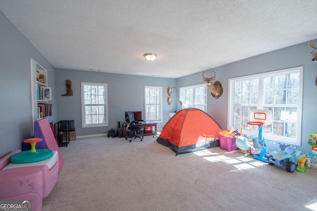 bedroom featuring carpet floors and a textured ceiling