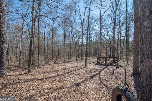 view of yard featuring a view of trees