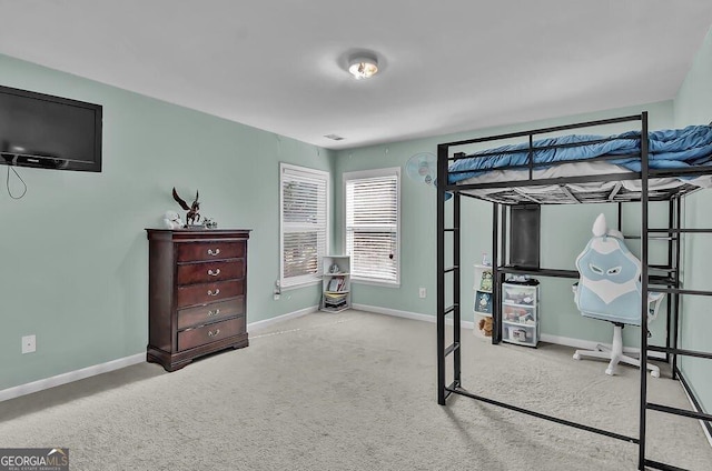 carpeted bedroom with baseboards