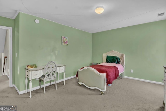 carpeted bedroom featuring baseboards and visible vents