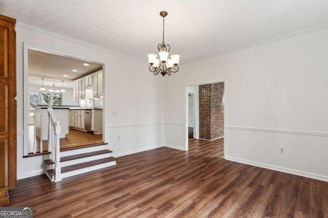 unfurnished dining area with a chandelier, dark wood-type flooring, stairway, and ornamental molding