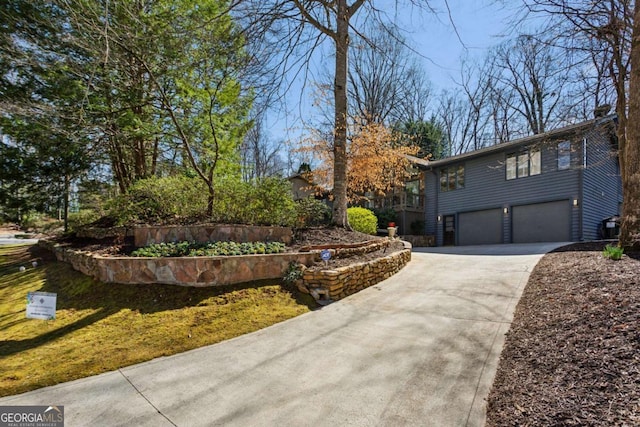 view of front facade featuring a garage and concrete driveway