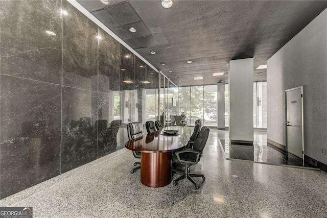 dining space with expansive windows