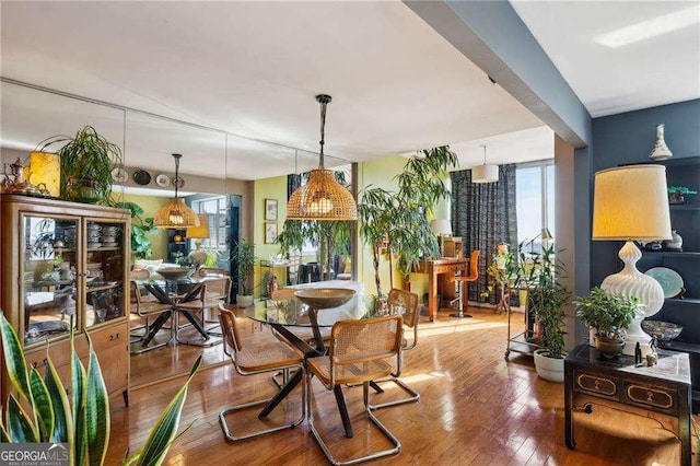 dining area with wood-type flooring