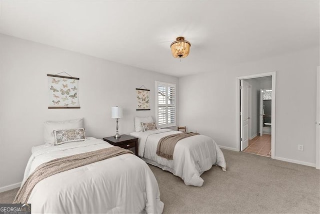 carpeted bedroom featuring baseboards