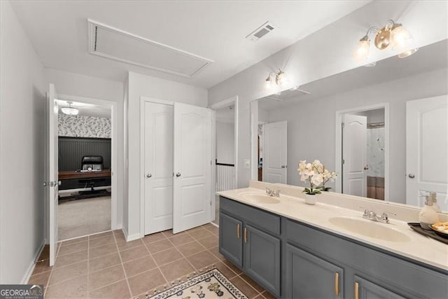 full bath featuring double vanity, visible vents, a sink, and tile patterned floors