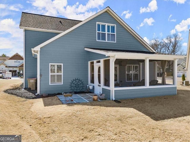 rear view of house with a sunroom