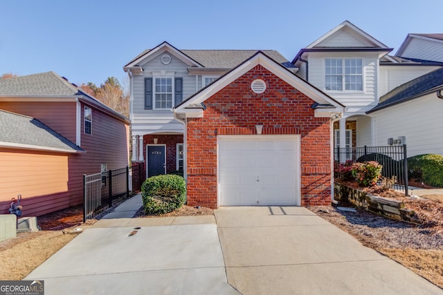 traditional-style house featuring concrete driveway, brick siding, fence, and an attached garage