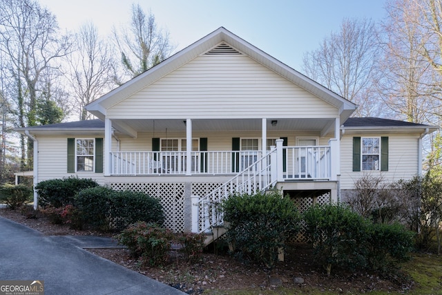 view of front of house with a porch and stairs