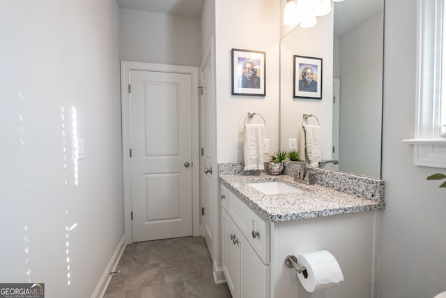 bathroom featuring vanity and baseboards