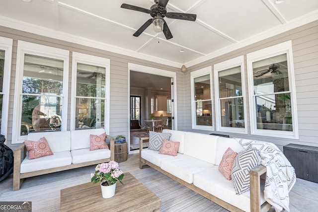 sunroom with coffered ceiling and a ceiling fan