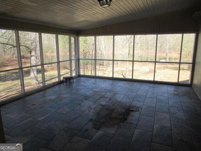 unfurnished sunroom with plenty of natural light