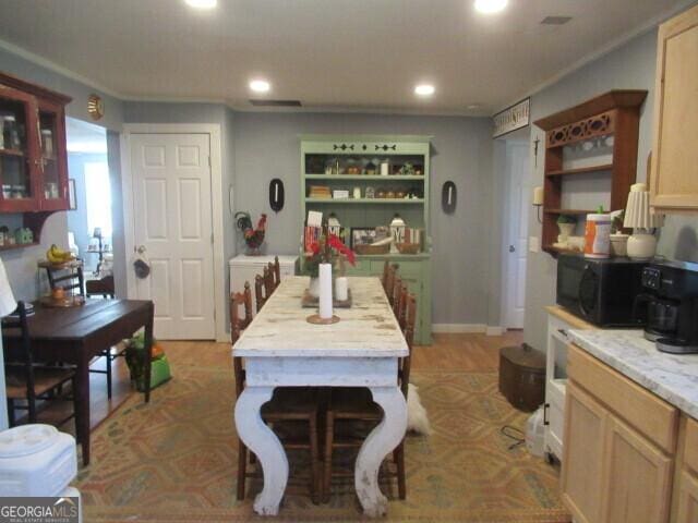 dining area featuring baseboards and recessed lighting