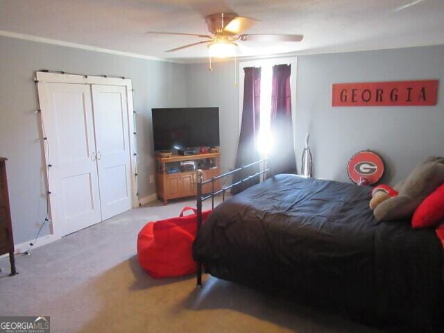 bedroom featuring carpet floors and ceiling fan