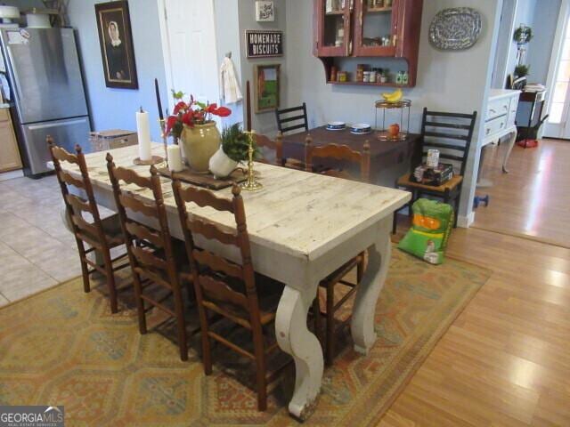 dining space featuring light wood-style flooring