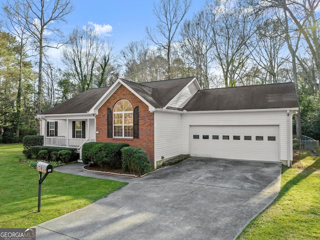 ranch-style home featuring a porch, concrete driveway, a front yard, a garage, and brick siding