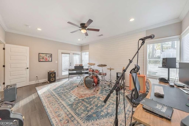 workout area featuring baseboards, wood finished floors, crown molding, french doors, and recessed lighting