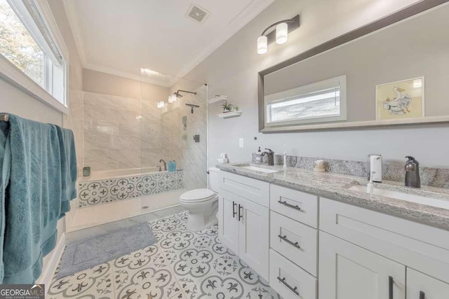 bathroom with toilet, visible vents, a sink, and ornamental molding