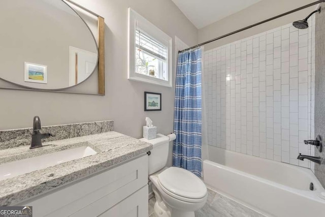 bathroom with toilet, shower / tub combo, and vanity