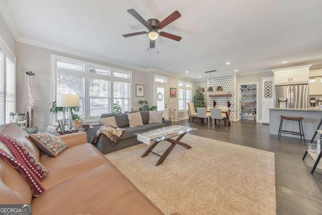 living room with ornamental molding, recessed lighting, a ceiling fan, and dark wood-style floors