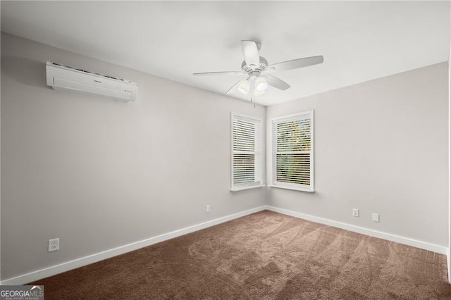 empty room with carpet, an AC wall unit, and baseboards