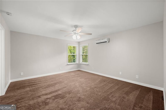 empty room with carpet floors, an AC wall unit, and baseboards