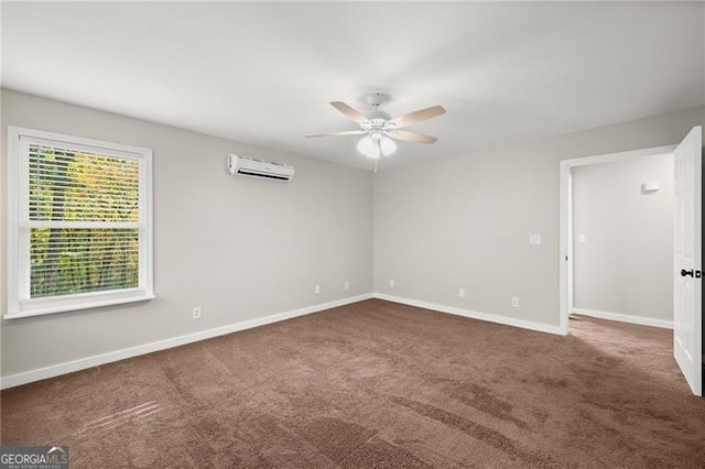 carpeted spare room featuring ceiling fan, an AC wall unit, and baseboards