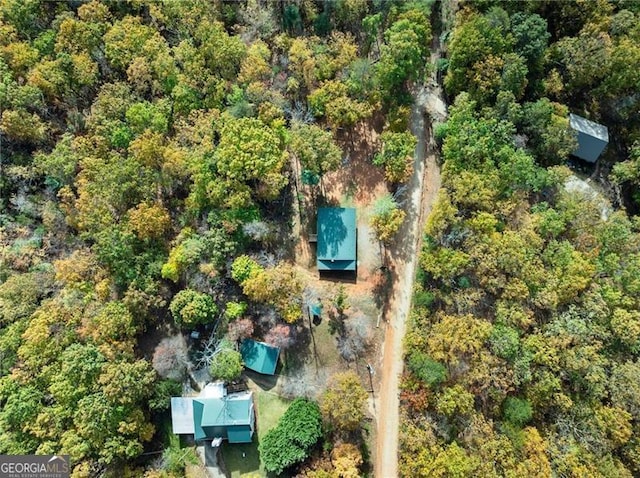 bird's eye view featuring a view of trees