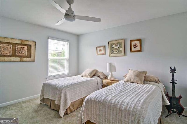 carpeted bedroom with baseboards and a ceiling fan