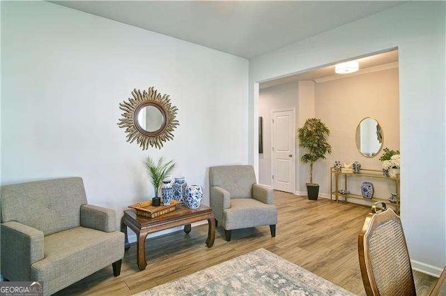 sitting room featuring wood finished floors and baseboards