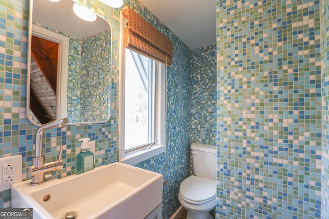106 Honeysuckle Ln NE, Milledgeville, GA 31061 - bathroom featuring healthy amount of natural light, tile walls, and vanity