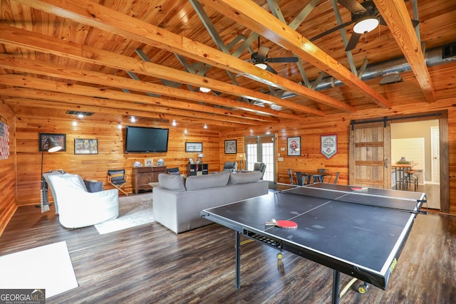 106 Honeysuckle Ln NE, Milledgeville, GA 31061 - playroom with wood finished floors, wood walls, a barn door, ceiling fan, and wood ceiling