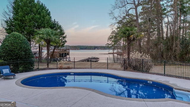 view of swimming pool with fence, a fenced in pool, and a patio