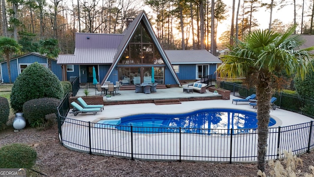 view of pool featuring a patio, fence, and a fenced in pool