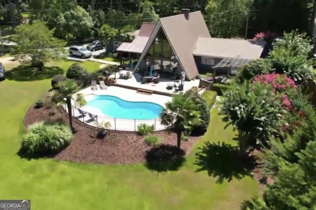 106 Honeysuckle Ln NE, Milledgeville, GA 31061 - view of swimming pool featuring a patio and a yard