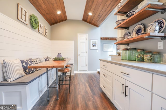 106 Honeysuckle Ln NE, Milledgeville, GA 31061 - kitchen with vaulted ceiling, dark wood-type flooring, open shelves, white cabinets, and recessed lighting