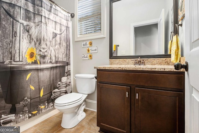 full bathroom with toilet, vanity, a shower with curtain, baseboards, and tile patterned floors