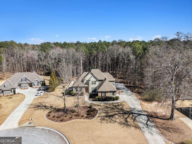 drone / aerial view featuring a view of trees