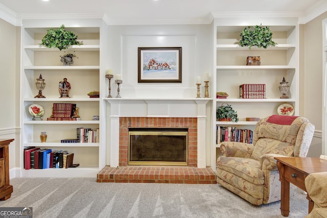 sitting room featuring a fireplace, built in features, and crown molding