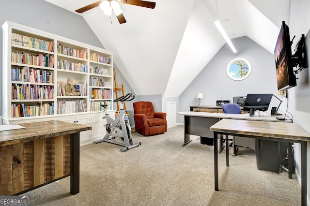 office featuring a ceiling fan, light carpet, and vaulted ceiling