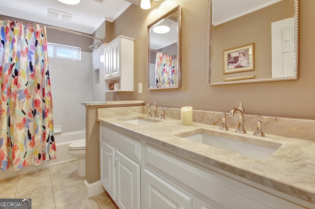 bathroom with toilet, tile patterned flooring, ornamental molding, and a sink