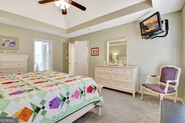 bedroom featuring ceiling fan, lofted ceiling, connected bathroom, and light colored carpet