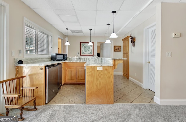 kitchen with a breakfast bar, light tile patterned floors, black microwave, and light countertops