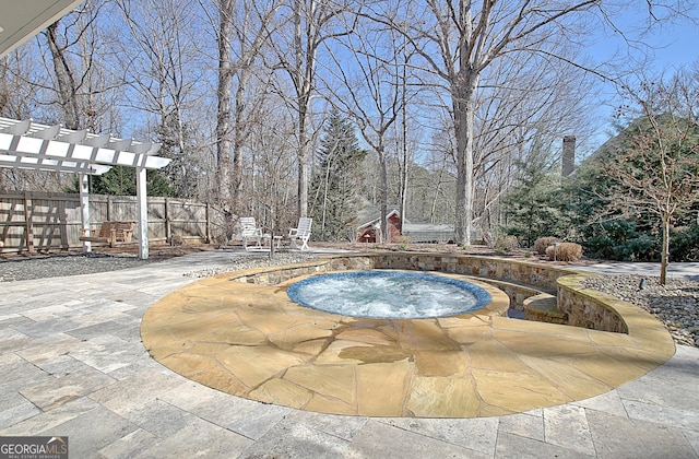 view of swimming pool with a pergola, a patio area, fence, and an in ground hot tub