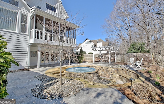 view of pool featuring an in ground hot tub, fence, a pergola, and a patio