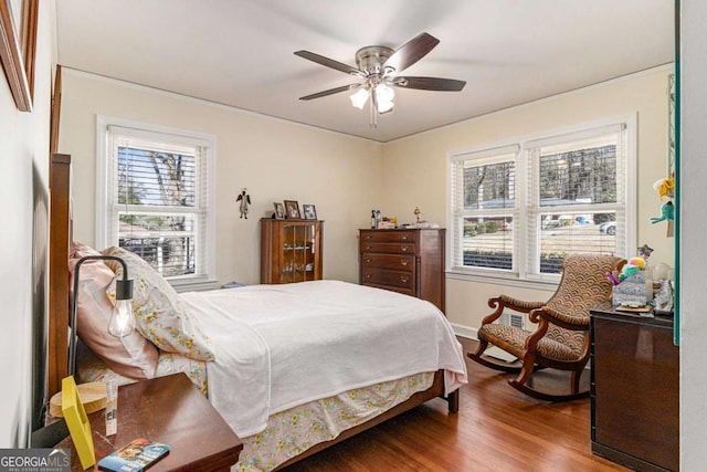 bedroom with ceiling fan and wood finished floors
